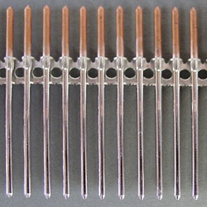 Feature 2 Parts are Attached to Strips to Form Bandoleers For Electropolishing.jpg