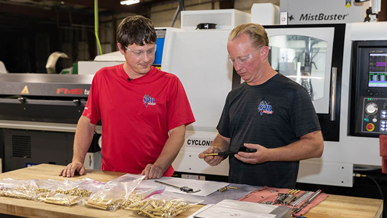CNC operator Dave Burton (left) and Scott Pater, co-owner and co-founder of SPR Machine