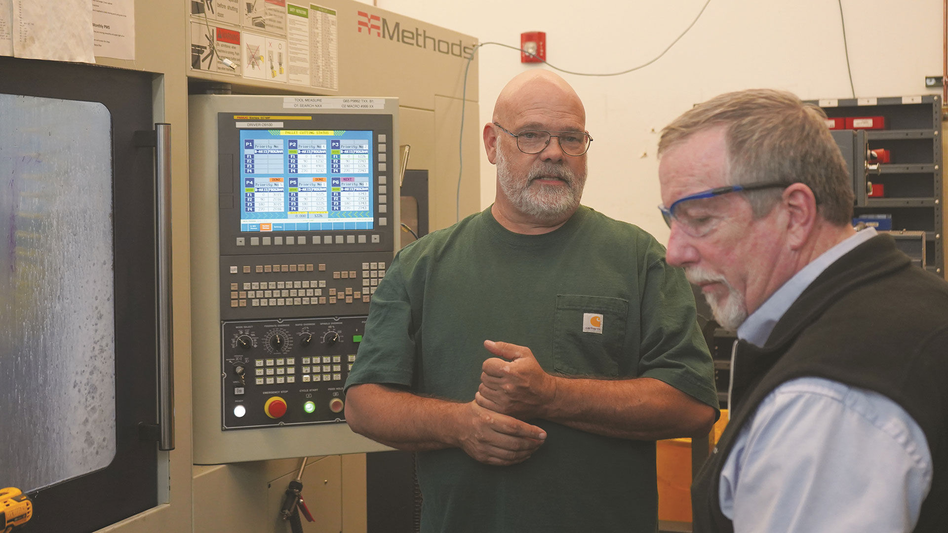 Greg Camron (left), shop manager at Alicat Scientific, and Bernie Otto, Kiwa product manager for Methods Machine Tools, going over the Kiwa KHM-300A PC6.